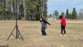 Girl kicking the ball upward.