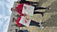 Aquin and Mr. Ireland holding up signs for the walk.